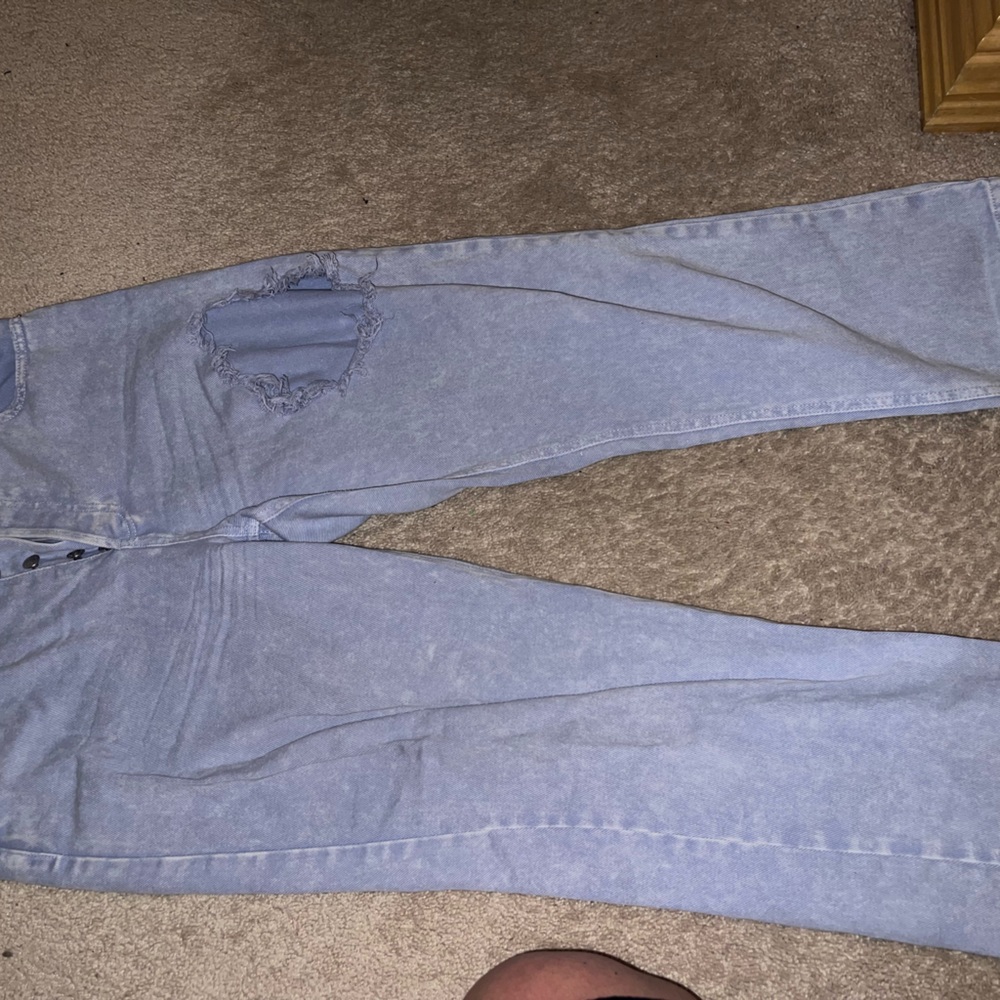 light blue ripped jeans